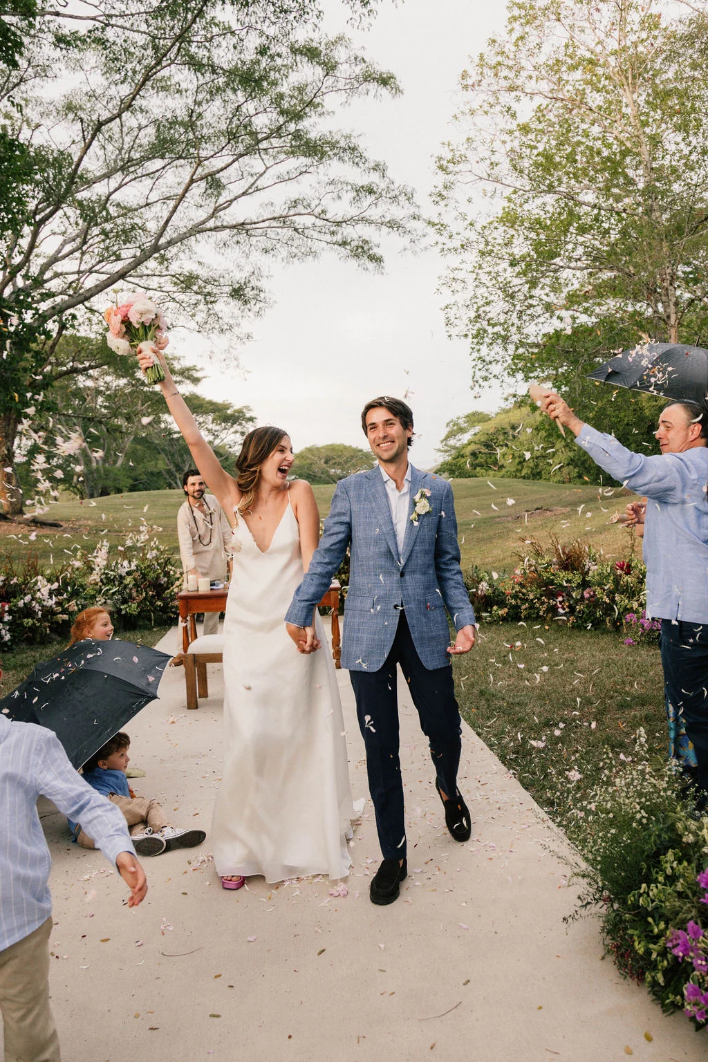 Luisa and Nicolás leaving their ceremony